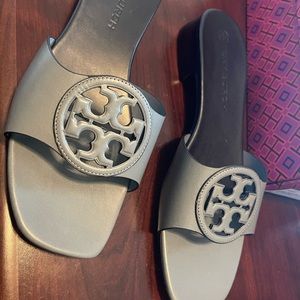 Light bluemiller slide. Brand New never been worn comes with box and dust bag.